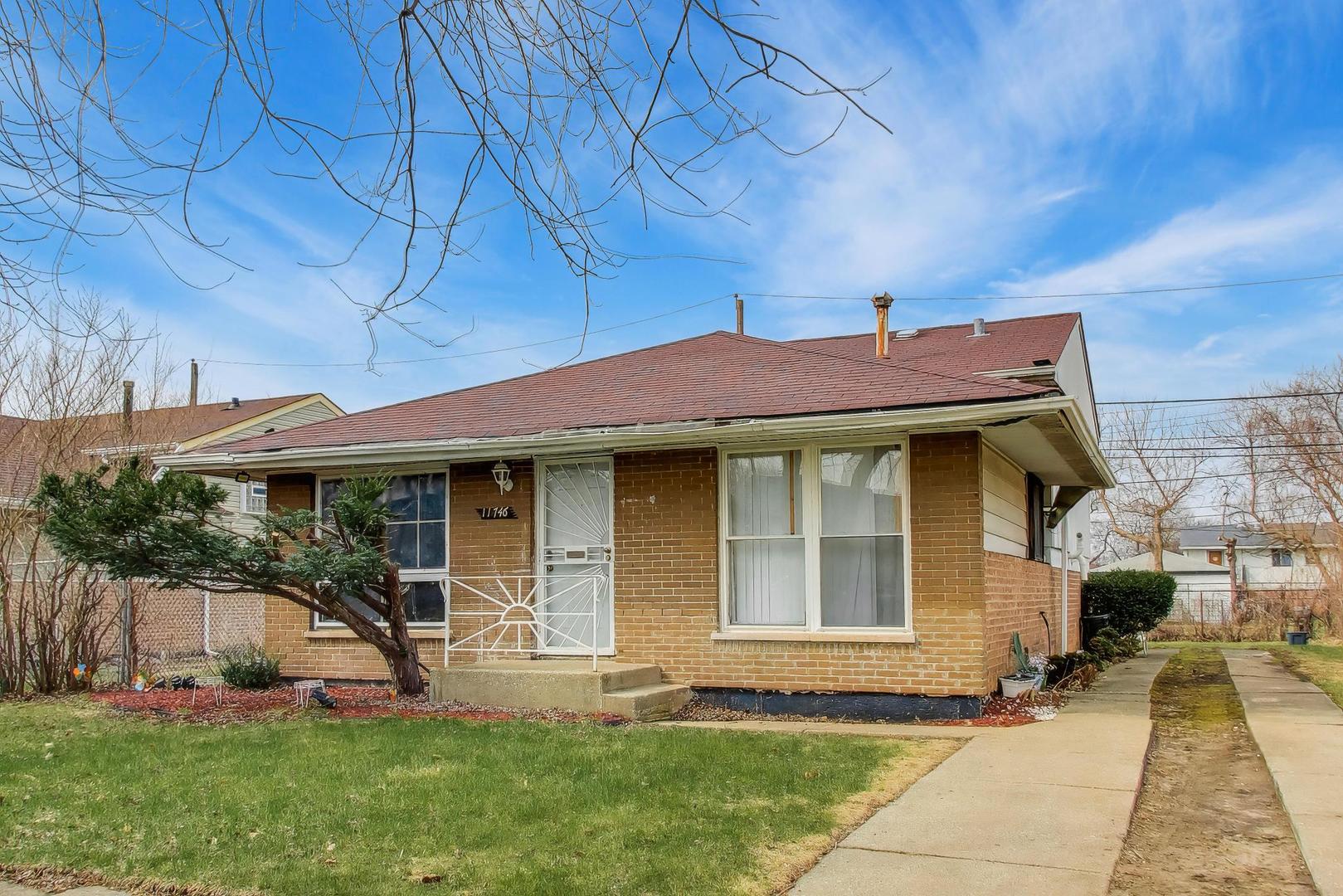 11746 South Racine Avenue Chicago, IL 60643 - Photo 2 of 24 a front view of a house with garden