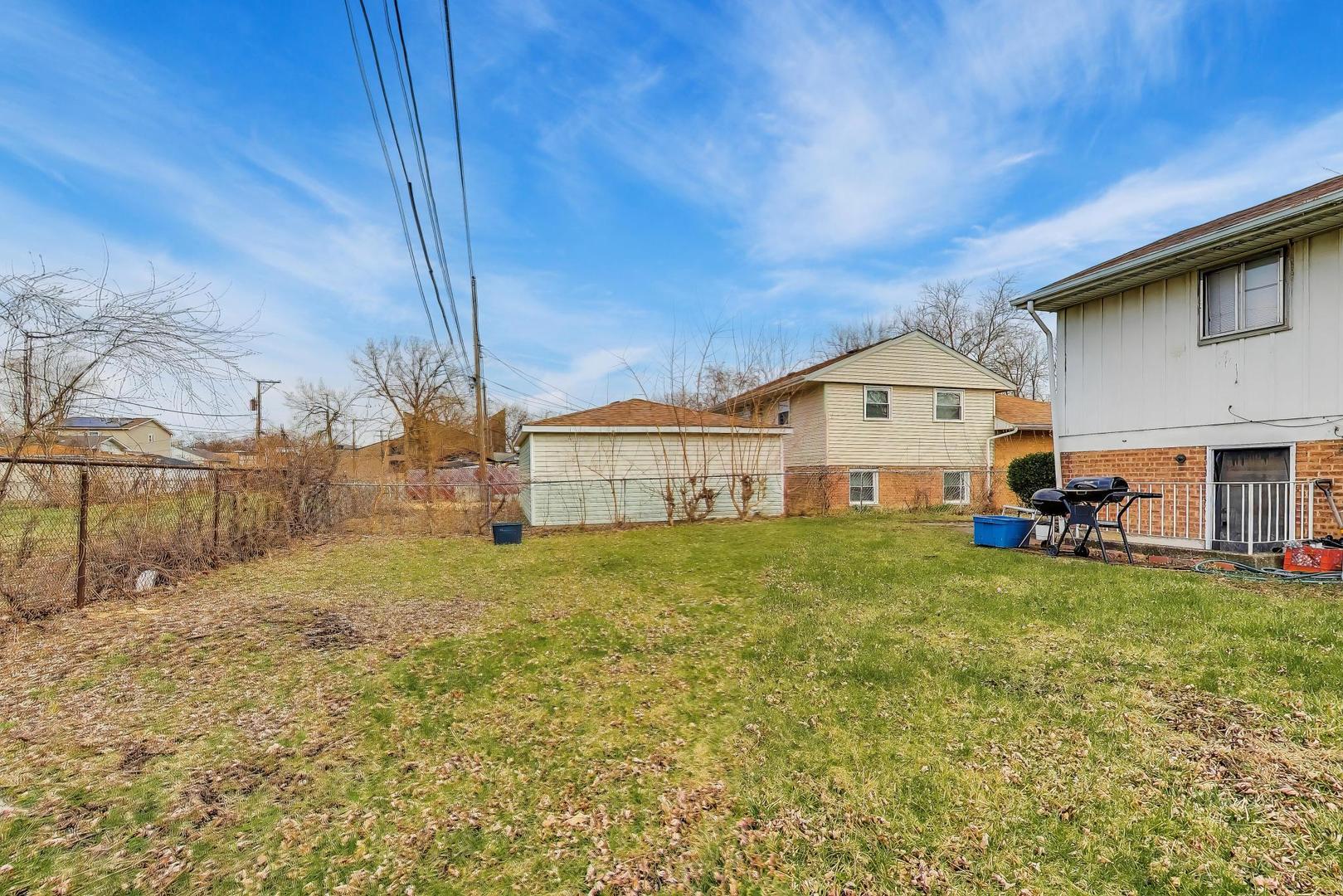 11746 South Racine Avenue Chicago, IL 60643 - Photo 21 of 24 a view of a house with backyard