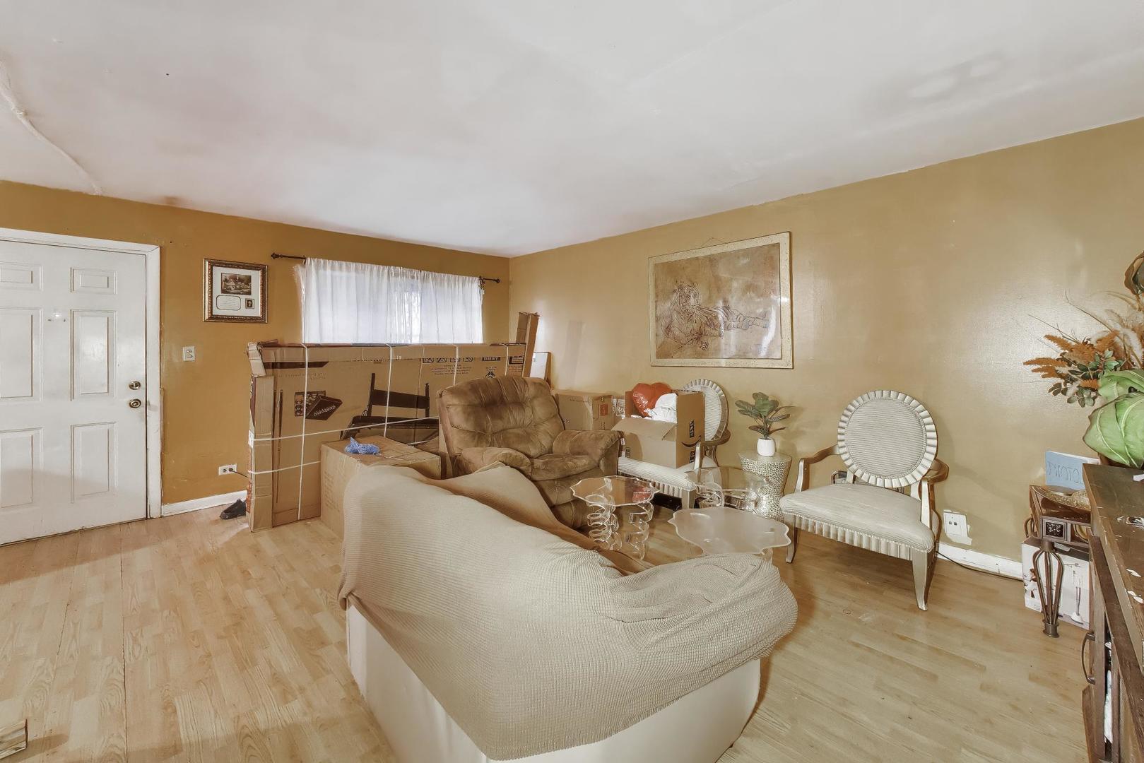 11746 South Racine Avenue Chicago, IL 60643 - Photo 4 of 24 a living room with furniture and a dining table