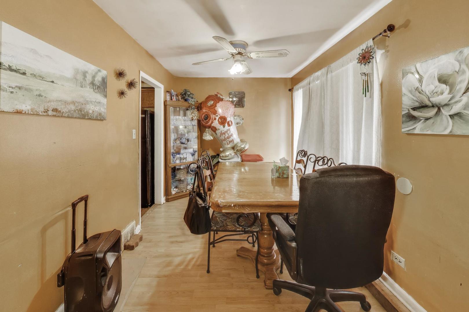 11746 South Racine Avenue Chicago, IL 60643 - Photo 5 of 24 a view of a workspace with furniture and a window
