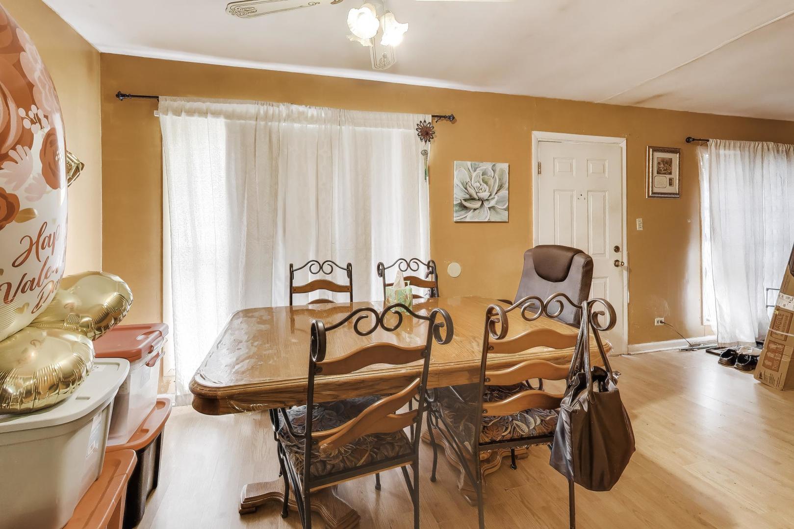 11746 South Racine Avenue Chicago, IL 60643 - Photo 6 of 24 a view of a dining room with furniture and wooden floor