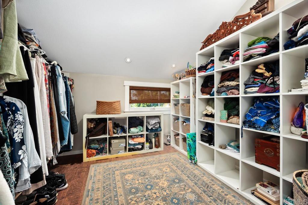 3112 Del Rey Avenue Carlsbad, CA 92009 - Photo 24 of 34 a view of walk in closet with clothes and shoes