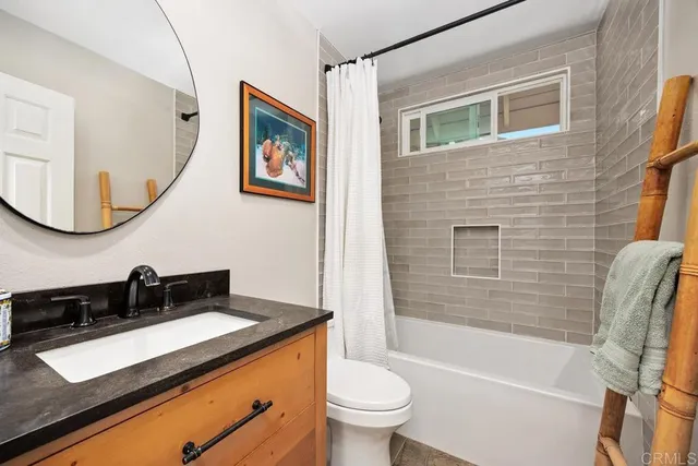 a bathroom with a sink a toilet and a bathtub