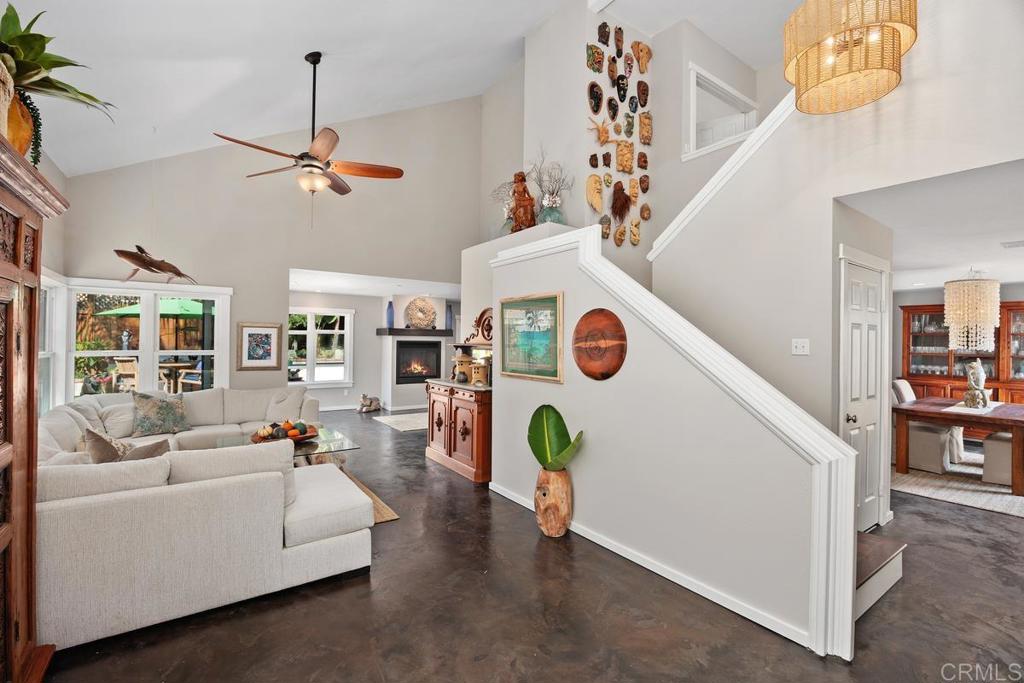 3112 Del Rey Avenue Carlsbad, CA 92009 - Photo 5 of 34 a living room with furniture and a chandelier