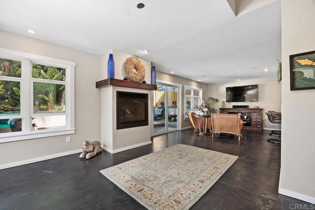3112 Del Rey Avenue Carlsbad, CA 92009 - Photo 7 of 34 a living room with furniture and a flat screen tv