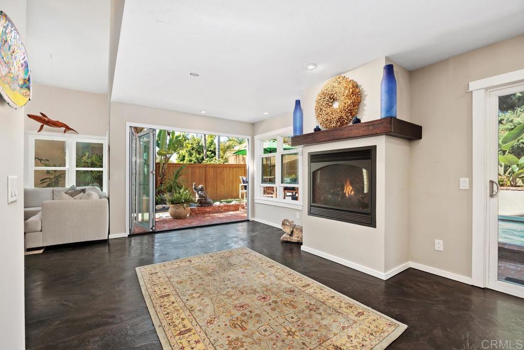 3112 Del Rey Avenue Carlsbad, CA 92009 - Photo 8 of 34 a living room with furniture and a fireplace