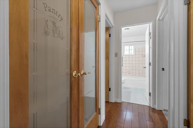 a view of a bathroom from the hallway