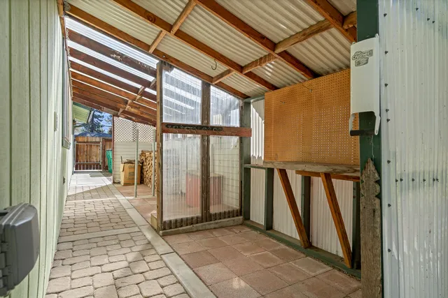 a view of a porch with wooden floor and stairs