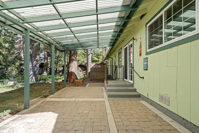 a view of a porch with wooden floor and stairs