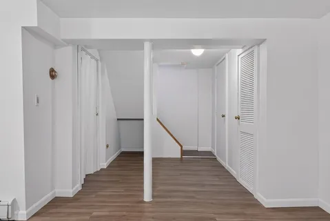 a view of entryway with wooden floor