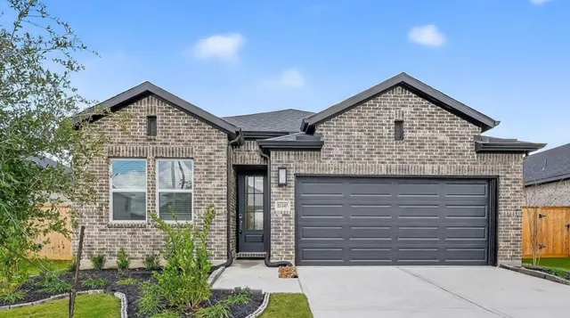 a front view of a house with a garage