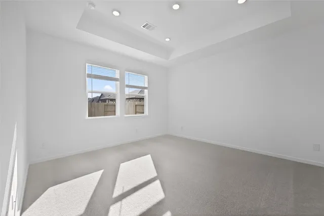 a view of wooden floor and windows in a room
