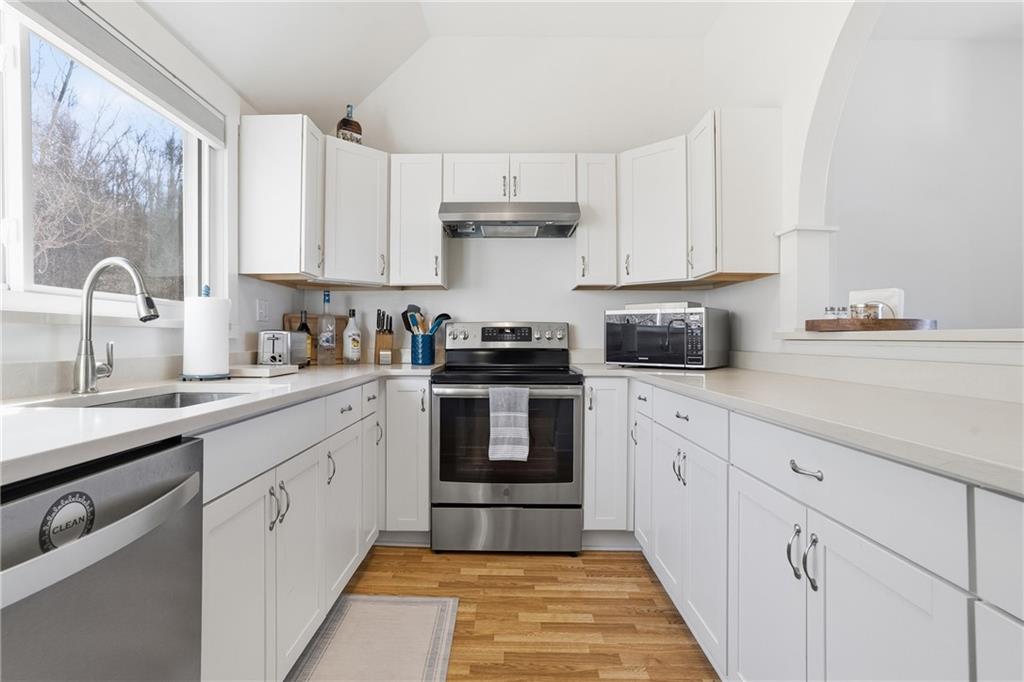 7 Ridgemead Fields Drive Verona, PA 15147 - Photo 14 of 42 The bright, galley-style kitchen offers an abundance of countertops space...