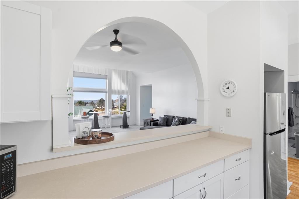 7 Ridgemead Fields Drive Verona, PA 15147 - Photo 18 of 42 The pass-through to the Great Room offers a wide open feel as well as the convenience of conveying dishes to the dining area.