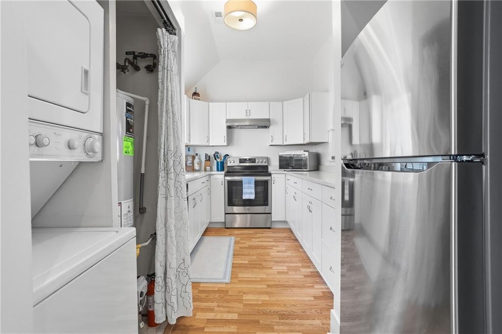 7 Ridgemead Fields Drive Verona, PA 15147 - Photo 21 of 42 Convenient stackable washer/dryer are tucked away in a kitchen closet.