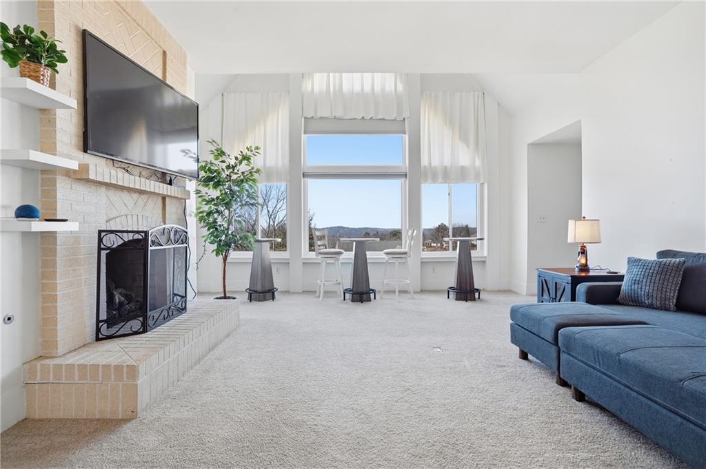 7 Ridgemead Fields Drive Verona, PA 15147 - Photo 4 of 42 The fireplace keeps the large space warm and cozy!