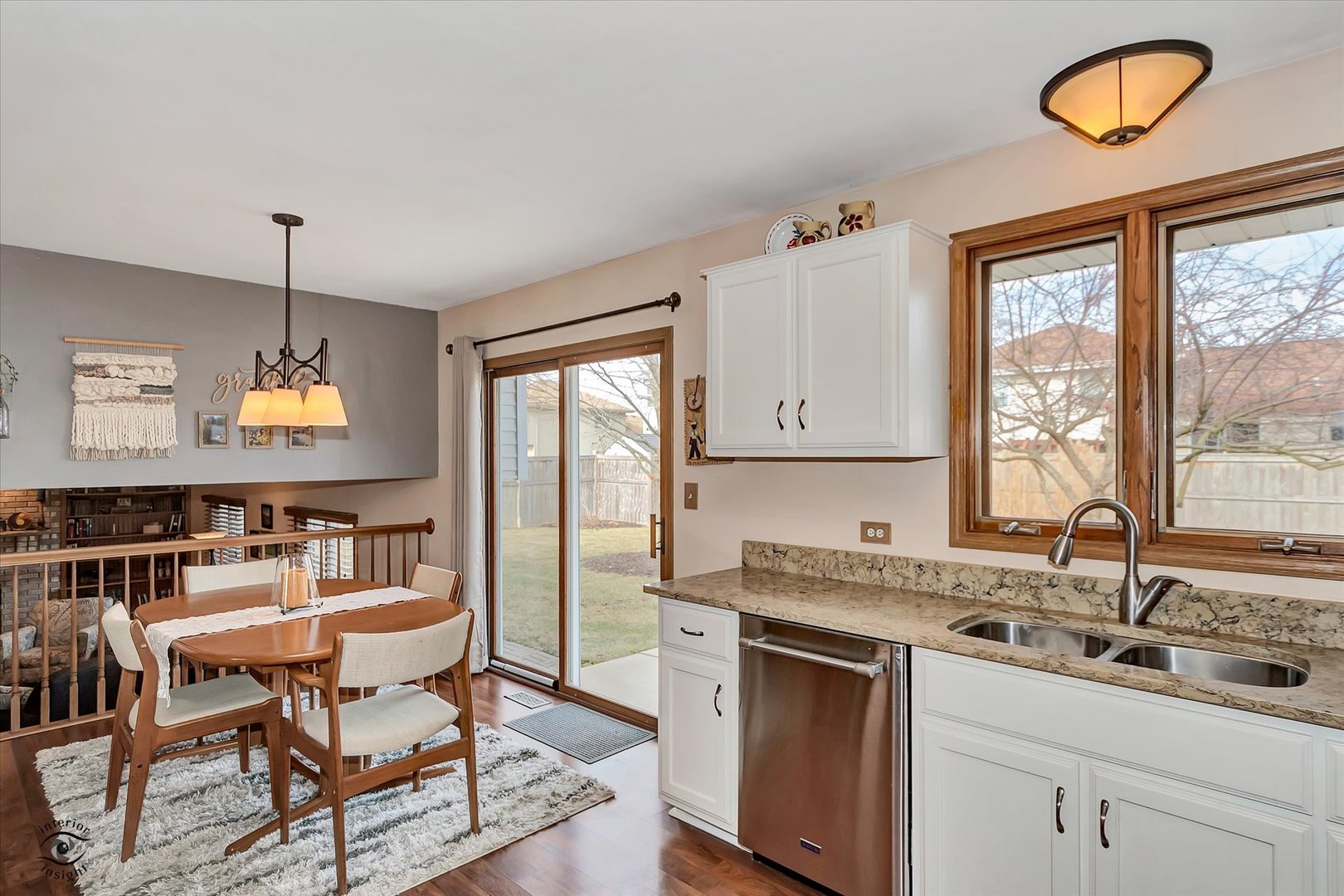 2909 Bisbee Drive Joliet, IL 60432 - Photo 9 of 23 a kitchen with a dining table chairs sink and cabinets