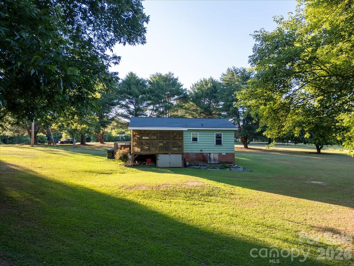 12282 Coyle Road Stanfield, NC 28163 - Photo 20 of 24 a view of a house with swimming pool next to a yard