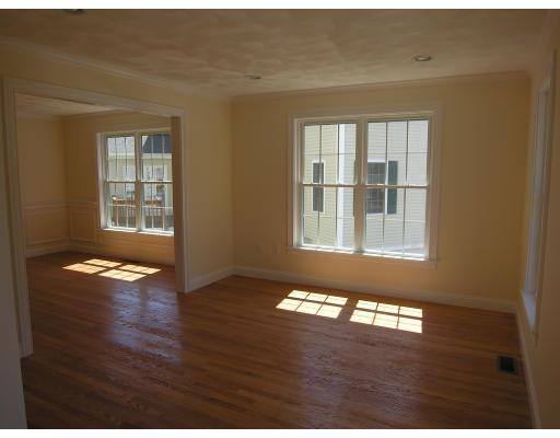 4 Knowles Farm Road Arlington, MA 02474 - Photo 6 of 12 a view of an empty room with wooden floor and a window