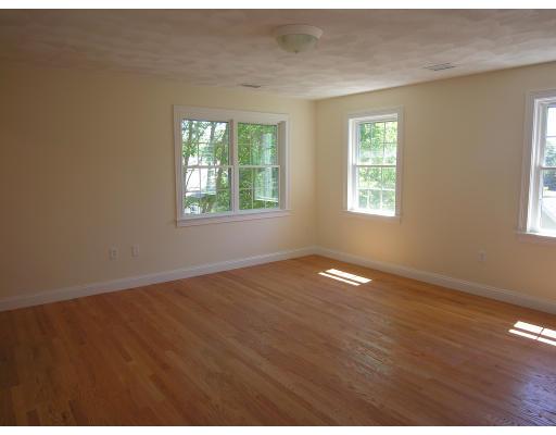 4 Knowles Farm Road Arlington, MA 02474 - Photo 8 of 12 a view of empty room with wooden floor and fan