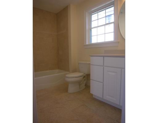 4 Knowles Farm Road Arlington, MA 02474 - Photo 10 of 12 a bathroom with a toilet a sink and a window