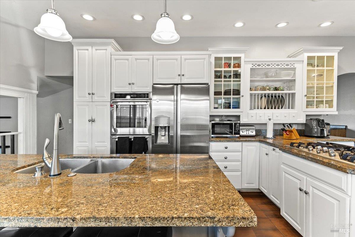 4457 Graywhaler Lane Rohnert Park, CA 94928 - Photo 11 of 51 a large kitchen with granite countertop a stove and cabinets