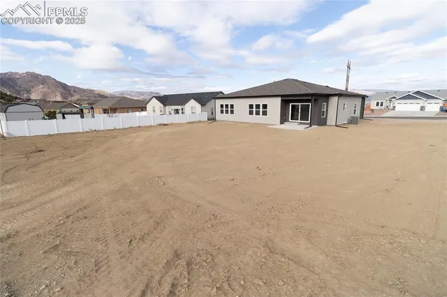 a view of a town with mountains in the background