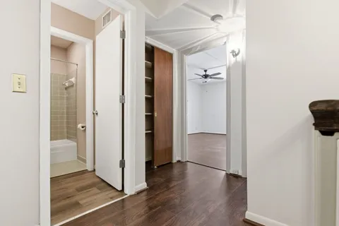 a view of a bathroom with a tub and shower