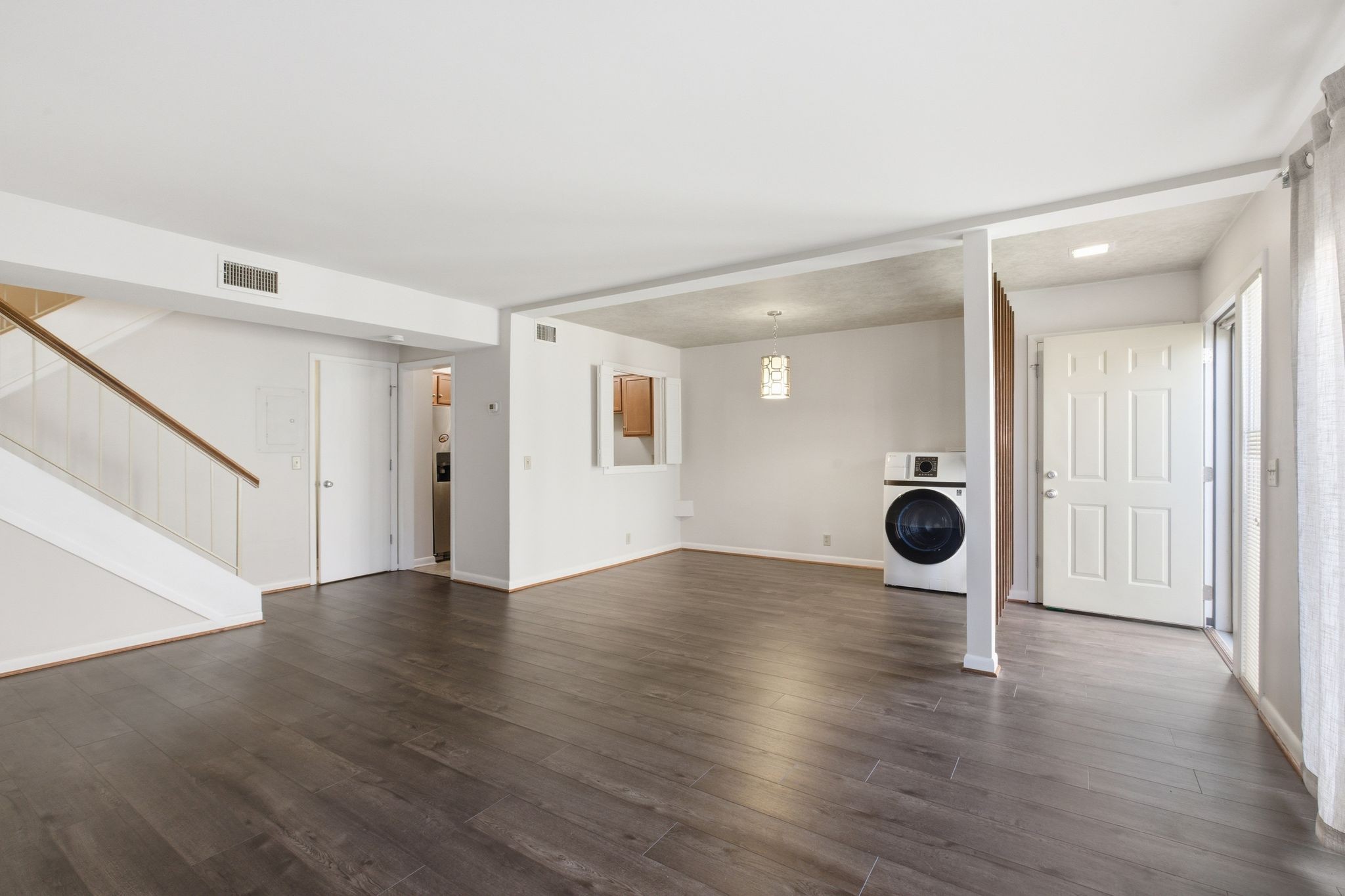 2116 Hobbs Road, Unit G6 Nashville, TN 37215 - Photo 7 of 30 an empty room with wooden floor and mirrors