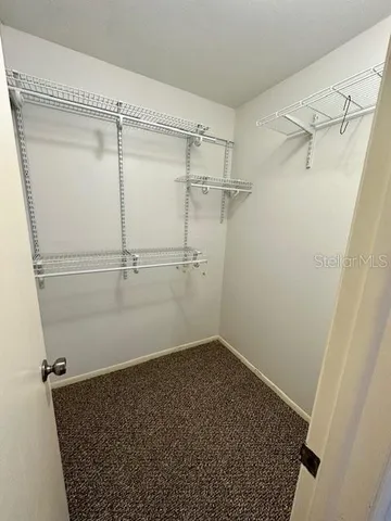 a view of a room with racks on the wall