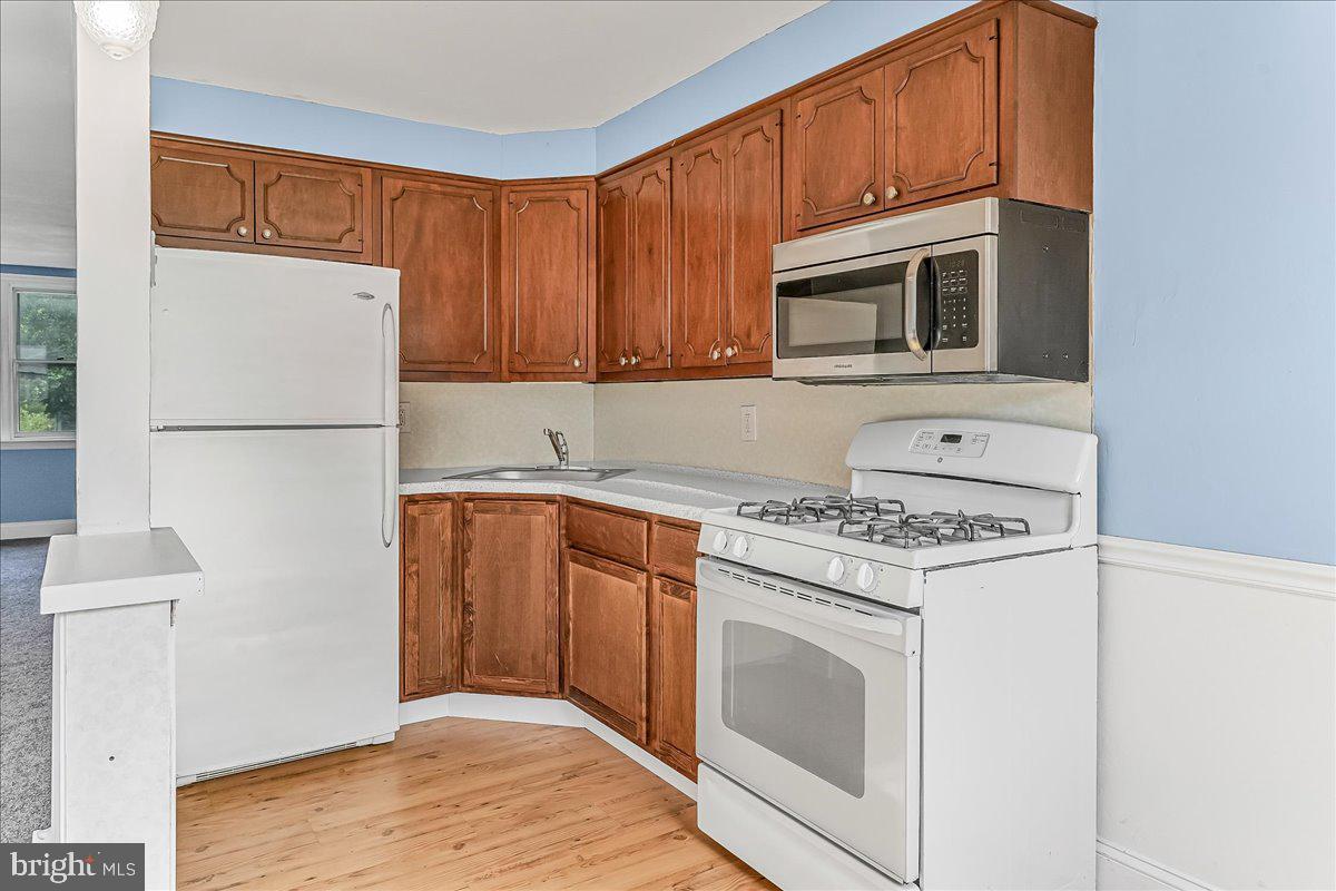 324 West Rively Avenue Glenolden, PA 19036 - Photo 11 of 27 a kitchen with granite countertop white cabinets and white appliances