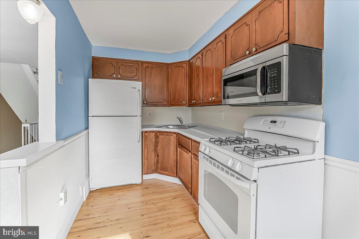 324 West Rively Avenue Glenolden, PA 19036 - Photo 12 of 27 a kitchen with cabinets stainless steel appliances and a sink