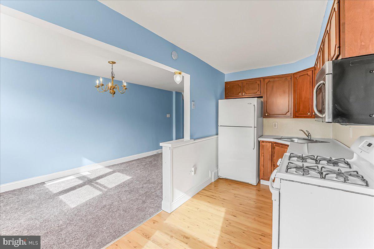 324 West Rively Avenue Glenolden, PA 19036 - Photo 15 of 27 a kitchen with a refrigerator and a stove top oven