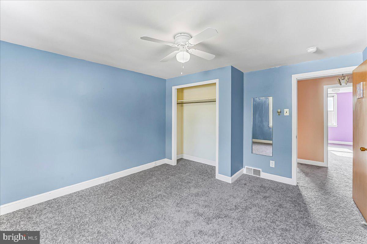 324 West Rively Avenue Glenolden, PA 19036 - Photo 22 of 27 an empty room with closet and a ceiling fan
