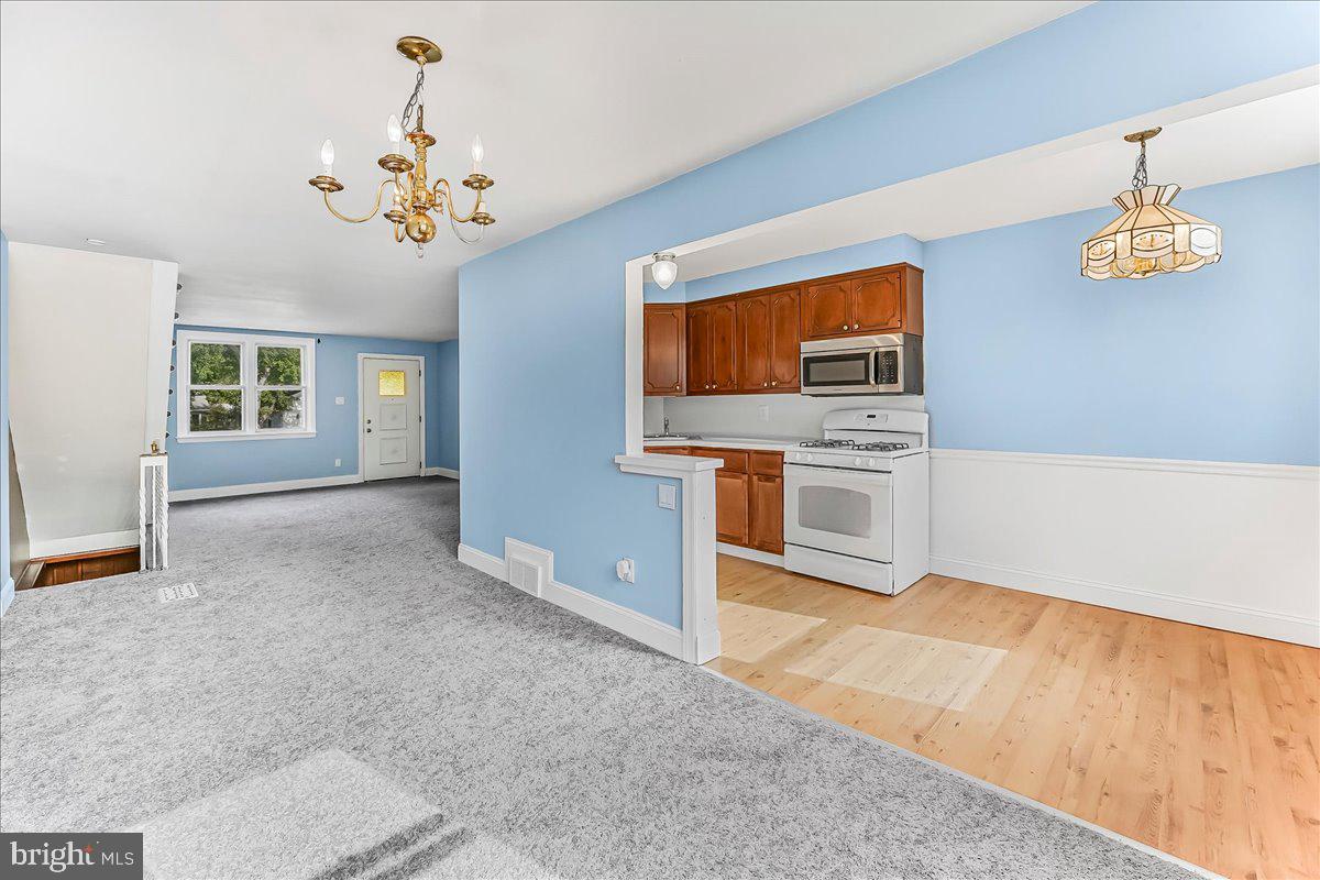 324 West Rively Avenue Glenolden, PA 19036 - Photo 10 of 27 a view of a kitchen with a sink cabinet and a living room