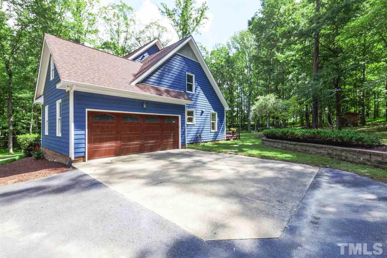 8228 Ridgeback Road Apex, NC 27523 - Photo 2 of 30 a front view of a house with a yard and garage