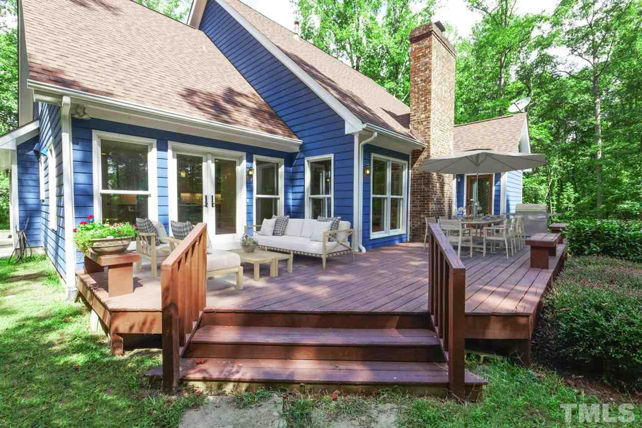 8228 Ridgeback Road Apex, NC 27523 - Photo 24 of 30 a view of a house with porch and chairs