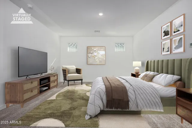 a bedroom with a bed and a flat screen tv