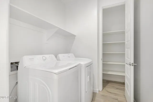 a utility room with dryer and washer