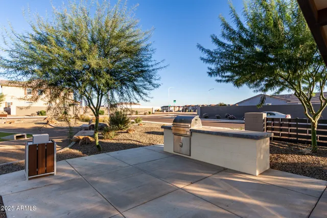 a view of a swimming pool with chairs