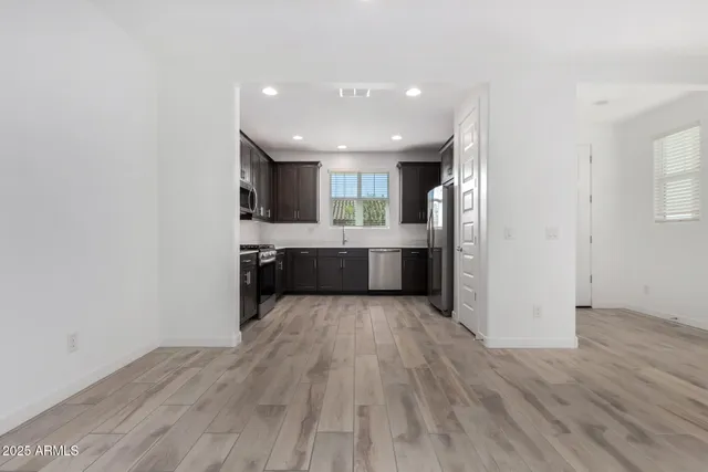 a view of kitchen with wooden floor
