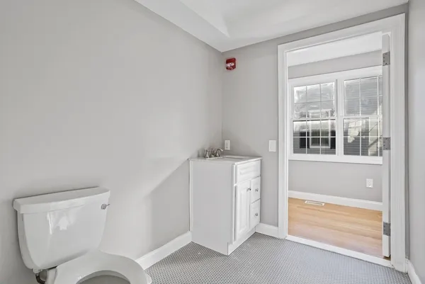 a bathroom with a toilet sink and tub