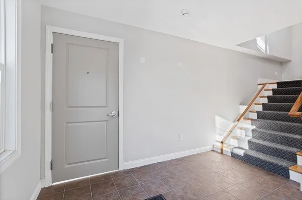 a view of entryway with stairs