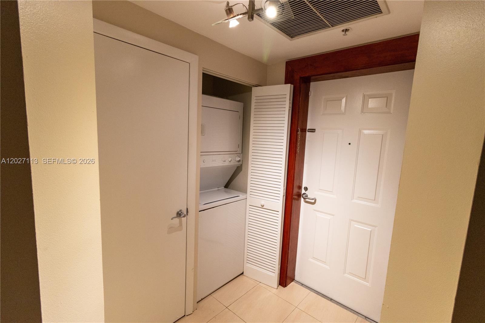 7275 Southwest 90th Way, Unit 213 Miami, FL 33156 - Photo 8 of 31 a view of a hallway with closet