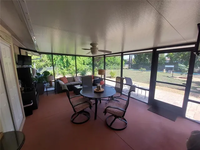 a view of a dining room with furniture window and outside view