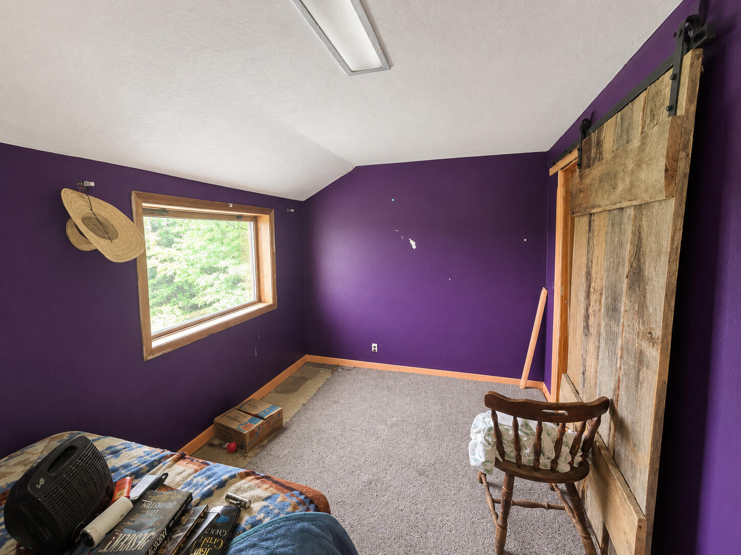 8545 Southeast Jeff Road Warren, IN 46792 - Photo 6 of 8 a bedroom with a bed and window