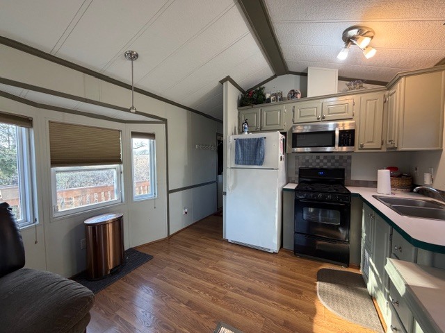 2795 East 28th Road Marseilles, IL 61341 - Photo 6 of 55 a kitchen with granite countertop a refrigerator stove and sink