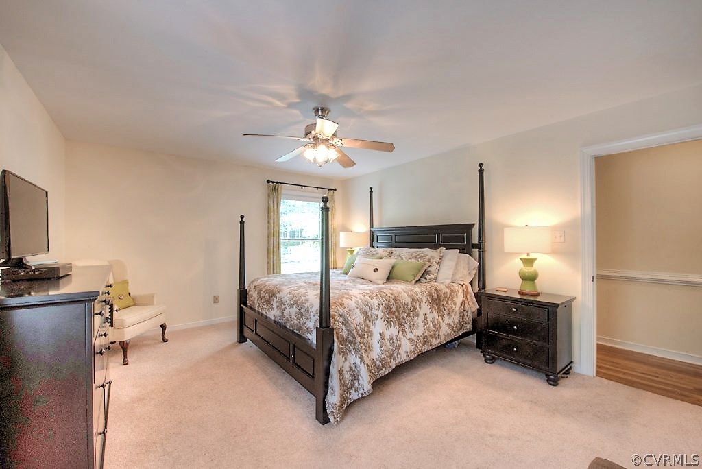 10800 Ramshorn Road Midlothian, VA 23113 - Photo 27 of 49 a bedroom with a bed and a chandelier