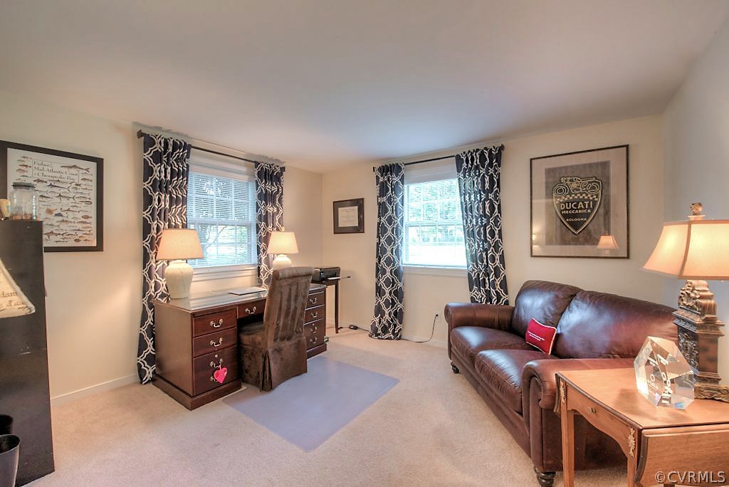 10800 Ramshorn Road Midlothian, VA 23113 - Photo 31 of 49 a living room with furniture and a fireplace