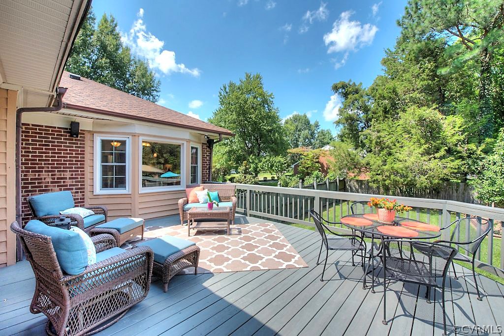 10800 Ramshorn Road Midlothian, VA 23113 - Photo 36 of 49 a patio with patio fireplace and wooden floor